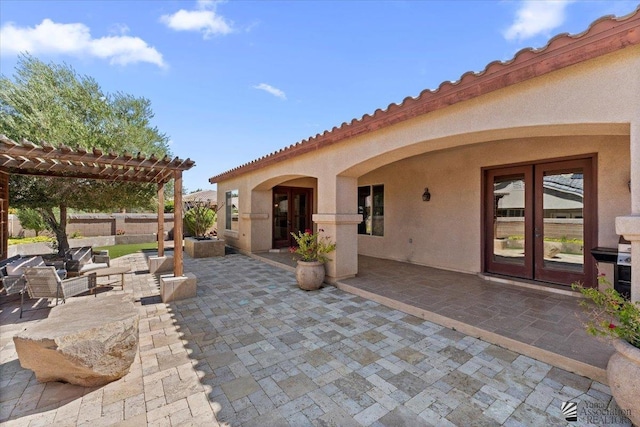 view of patio / terrace with french doors, a pergola, fence, and outdoor lounge area