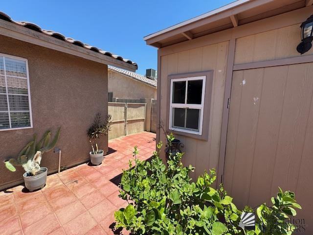 view of patio featuring fence