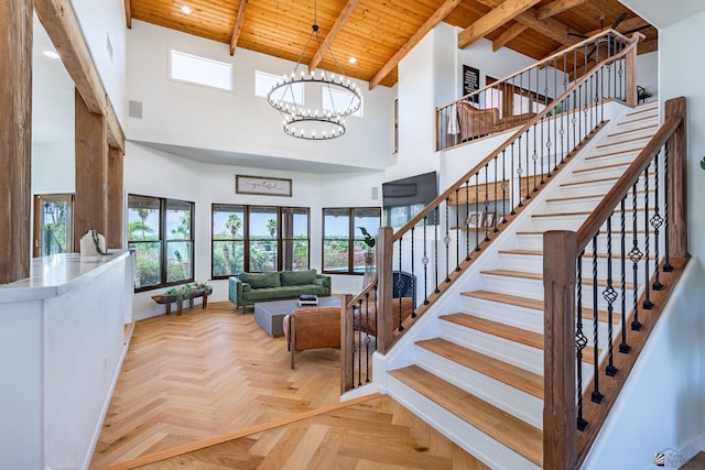 1645 W El Paseo Real, Yuma, AZ 85364 - stairs with a wood ceiling with exposed beams, a towering ceiling, a chandelier, and recessed lighting