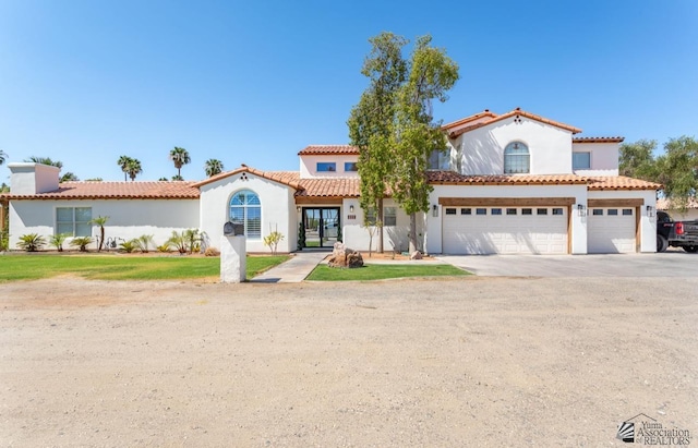 1645 W El Paseo Real, Yuma, AZ 85364 - mediterranean / spanish home with stucco siding, concrete driveway, and a garage