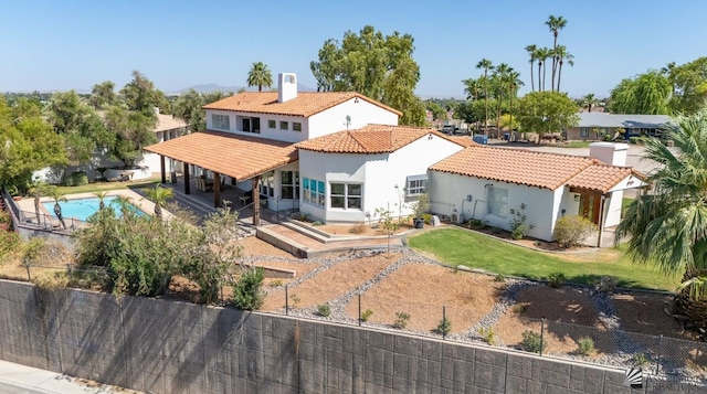 1645 W El Paseo Real, Yuma, AZ 85364 - back of property featuring a tiled roof, stucco siding, and a patio area