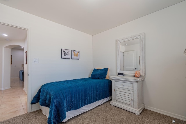 13215 S Renee Ave, Yuma, AZ 85367 - bedroom with arched walkways, baseboards, and light carpet