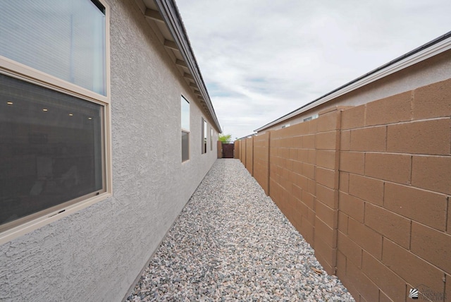 7563 E 35th Ln, Yuma, AZ 85365 - view of side of property with stucco siding and a fenced backyard