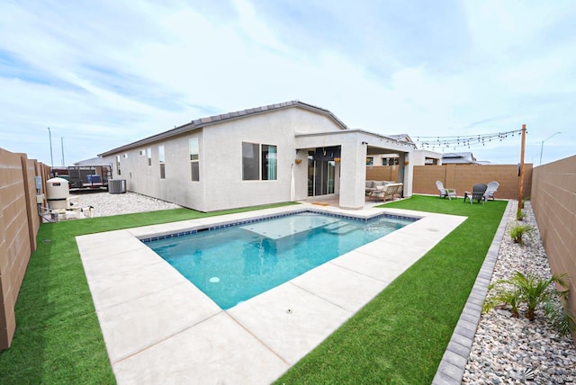 7563 E 35th Ln, Yuma, AZ 85365 - view of pool with central air condition unit, a patio area, and an outdoor hangout area
