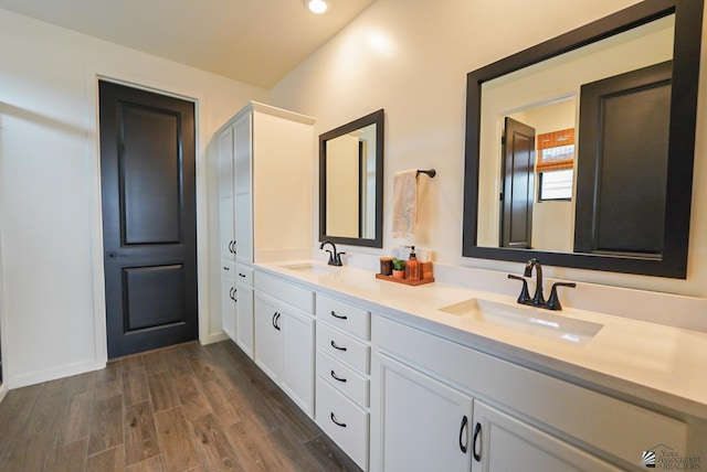 7563 E 35th Ln, Yuma, AZ 85365 - full bath with double vanity, wood finished floors, recessed lighting, and baseboards