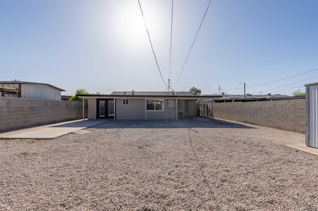 back of house with a patio area and a fenced backyard