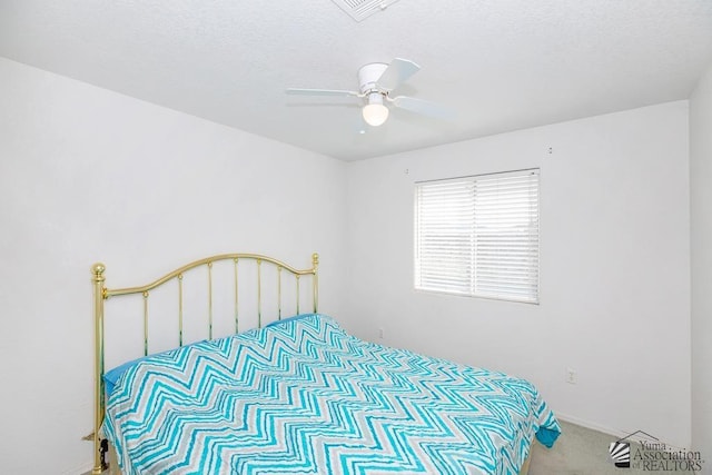 12614 E 45th Dr, Yuma, AZ 85367 - carpeted bedroom featuring visible vents, a ceiling fan, and a textured ceiling