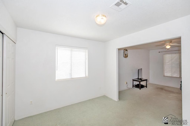 12614 E 45th Dr, Yuma, AZ 85367 - interior space with carpet floors, ceiling fan, and visible vents