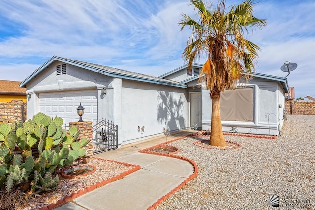 12614 E 45th Dr, Yuma, AZ 85367 - view of front of house featuring an attached garage and stucco siding