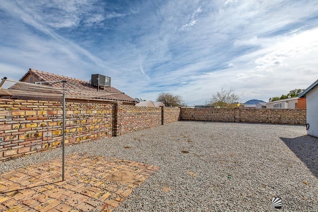 12614 E 45th Dr, Yuma, AZ 85367 - view of yard featuring a fenced backyard and central AC unit