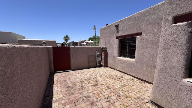13725 E 46th St, Yuma, AZ 85367 - view of patio / terrace featuring fence and a gate