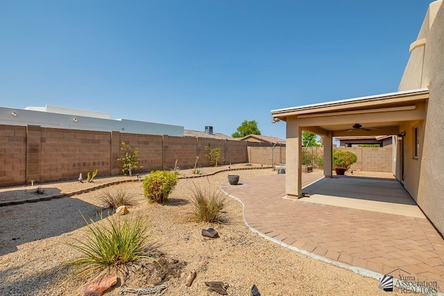 11561 E 25th Pl, Yuma, AZ 85367 - fenced backyard featuring a patio and ceiling fan