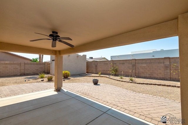 11561 E 25th Pl, Yuma, AZ 85367 - fenced backyard with ceiling fan and a patio