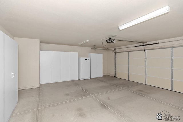 11561 E 25th Pl, Yuma, AZ 85367 - garage featuring freestanding refrigerator and a garage door opener