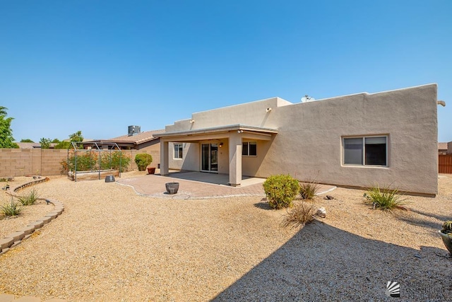 11561 E 25th Pl, Yuma, AZ 85367 - back of property with stucco siding and a patio
