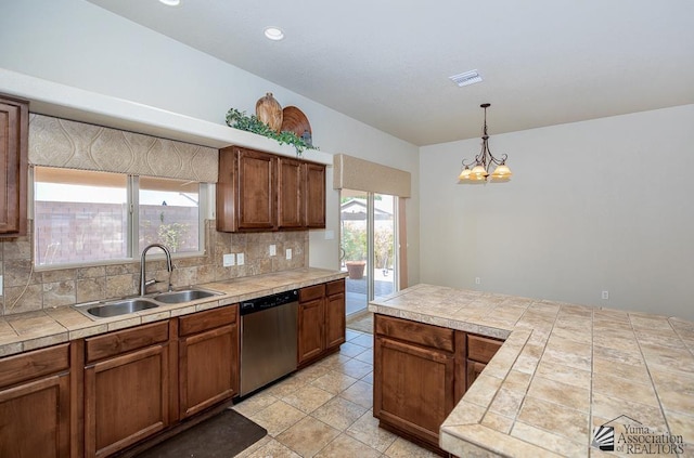 11561 E 25th Pl, Yuma, AZ 85367 - kitchen with tasteful backsplash, dishwasher, pendant lighting, a chandelier, and tile counters