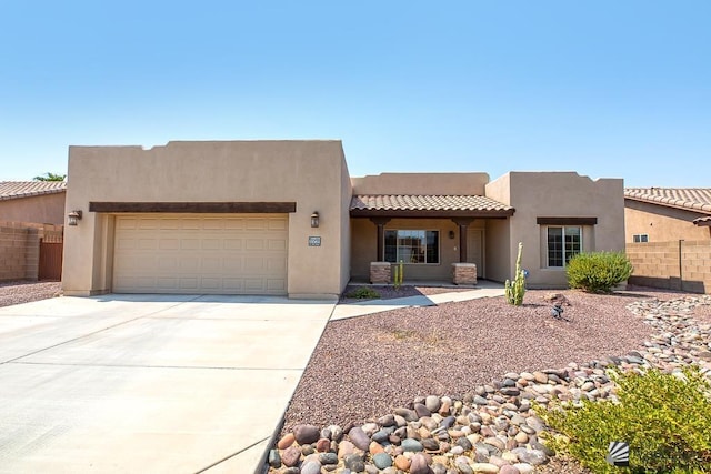 11561 E 25th Pl, Yuma, AZ 85367 - southwest-style home featuring an attached garage, stucco siding, driveway, and a tiled roof