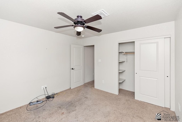 11561 E 25th Pl, Yuma, AZ 85367 - unfurnished bedroom with carpet floors, a closet, and a ceiling fan
