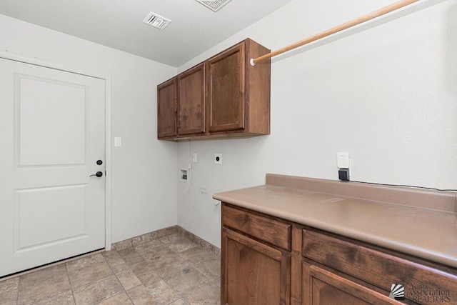 11561 E 25th Pl, Yuma, AZ 85367 - laundry area featuring electric dryer hookup, washer hookup, cabinet space, and stone finish flooring