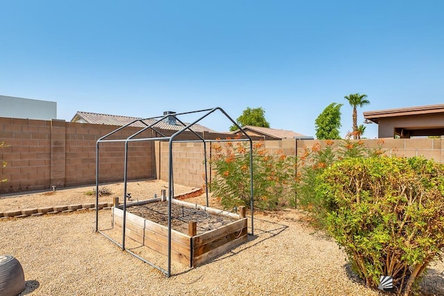 11561 E 25th Pl, Yuma, AZ 85367 - fenced backyard featuring a vegetable garden