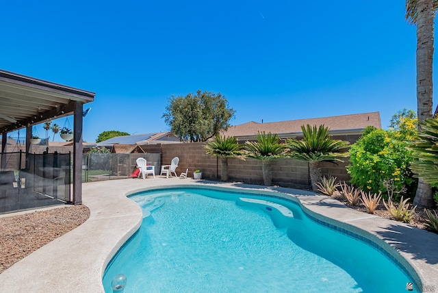 view of pool featuring a patio, a fenced in pool, and a fenced backyard