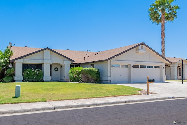 single story home with a garage, driveway, a front yard, and a shingled roof