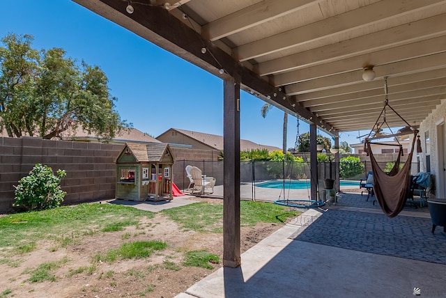 view of patio / terrace with a fenced in pool and a fenced backyard