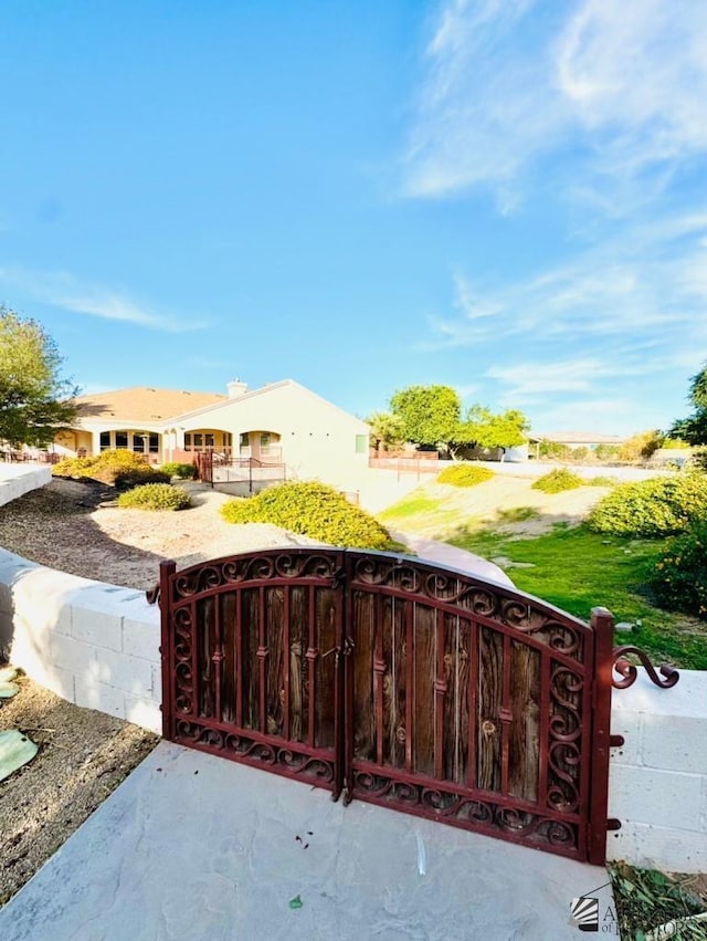 view of gate with fence