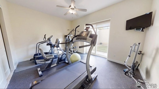 exercise room with baseboards and a ceiling fan