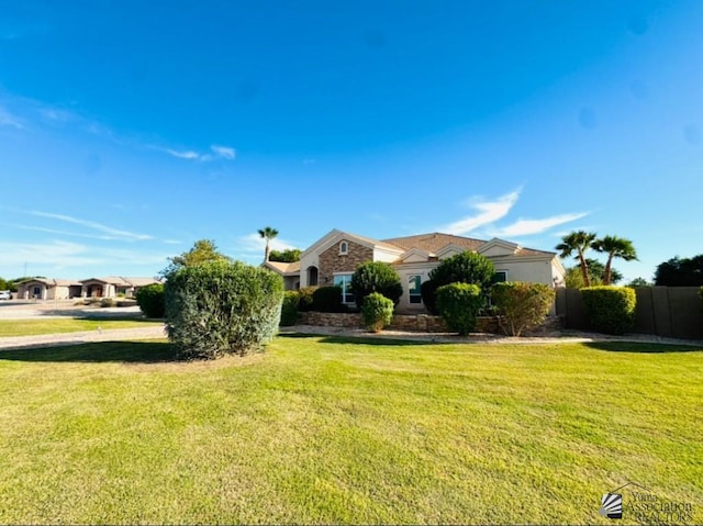 exterior space with a yard and fence