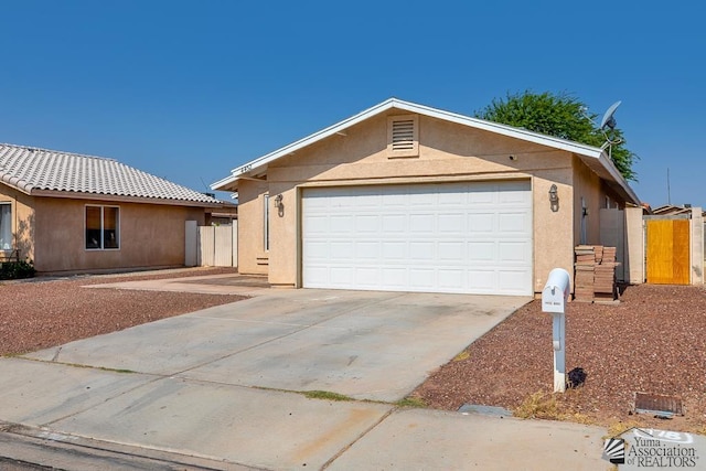 4452 S Agave Ave, Yuma, AZ 85365 - ranch-style house featuring stucco siding, a garage, and driveway