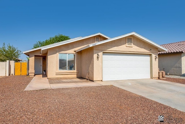 4452 S Agave Ave, Yuma, AZ 85365 - ranch-style house featuring stucco siding, concrete driveway, and a garage