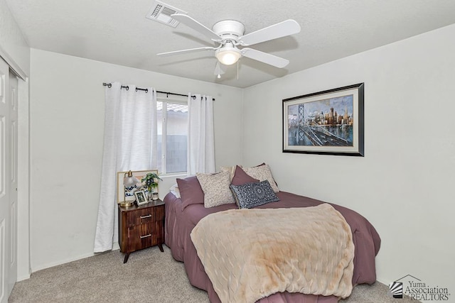 4452 S Agave Ave, Yuma, AZ 85365 - bedroom featuring light colored carpet, a closet, and ceiling fan