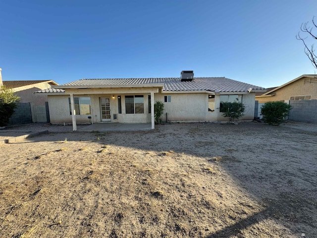 11278 E 24th Pl, Yuma, AZ 85367 - rear view of property with a patio, stucco siding, a chimney, and fence
