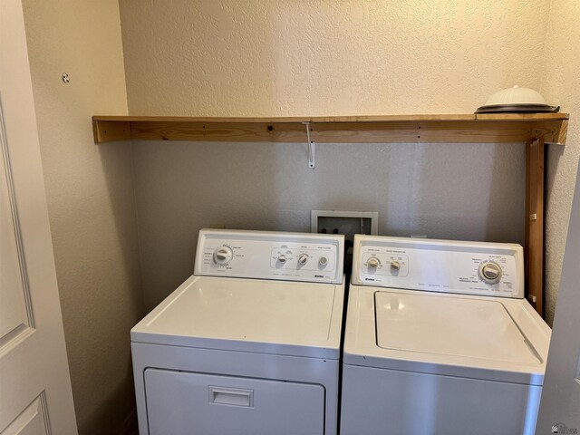 11278 E 24th Pl, Yuma, AZ 85367 - clothes washing area with a textured wall, laundry area, and washing machine and clothes dryer