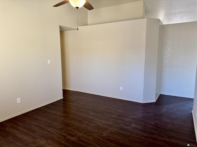 11278 E 24th Pl, Yuma, AZ 85367 - empty room with baseboards, ceiling fan, and dark wood-style flooring