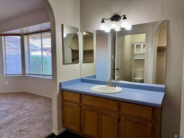 11278 E 24th Pl, Yuma, AZ 85367 - bathroom with vanity, a textured wall, and toilet