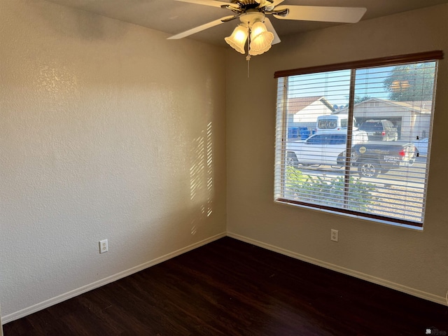11278 E 24th Pl, Yuma, AZ 85367 - unfurnished room featuring baseboards, a ceiling fan, wood finished floors, and a healthy amount of sunlight