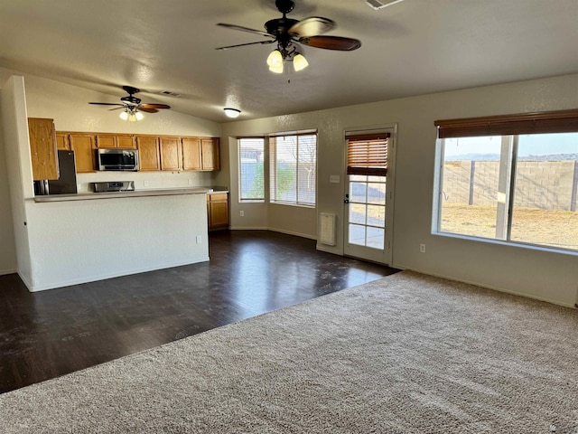 11278 E 24th Pl, Yuma, AZ 85367 - kitchen with fridge, stainless steel microwave, open floor plan, and ceiling fan