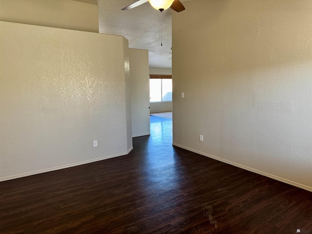 11278 E 24th Pl, Yuma, AZ 85367 - unfurnished room featuring dark wood-style flooring, baseboards, and a ceiling fan