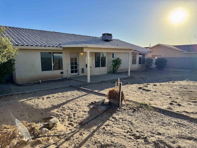 11278 E 24th Pl, Yuma, AZ 85367 - rear view of house with stucco siding, a patio area, fence, and a tiled roof