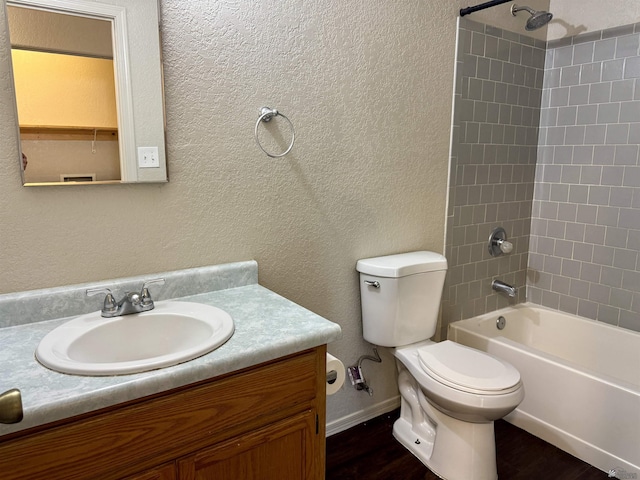 11278 E 24th Pl, Yuma, AZ 85367 - full bathroom with vanity, a textured wall, toilet, baseboards, and shower / washtub combination