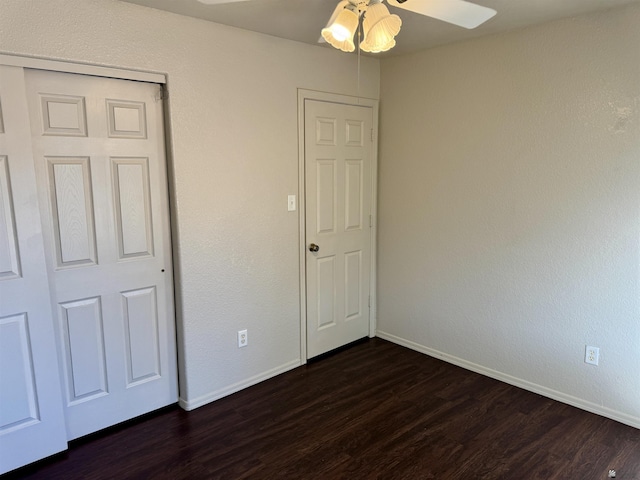 11278 E 24th Pl, Yuma, AZ 85367 - unfurnished bedroom featuring baseboards, dark wood finished floors, and ceiling fan