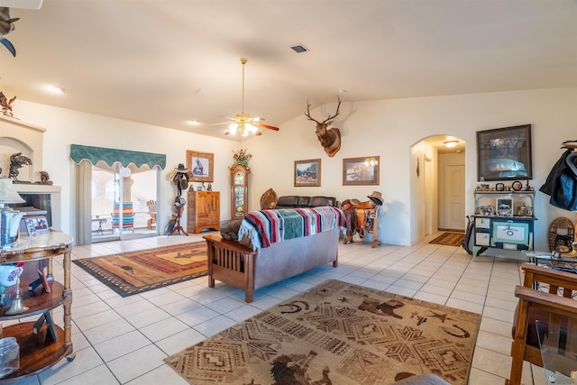 14530 E 55th St, Yuma, AZ 85367 - living room with arched walkways, a ceiling fan, light tile patterned floors, and vaulted ceiling