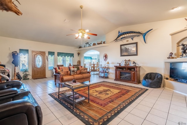 14530 E 55th St, Yuma, AZ 85367 - living room with a ceiling fan, arched walkways, vaulted ceiling, and light tile patterned floors