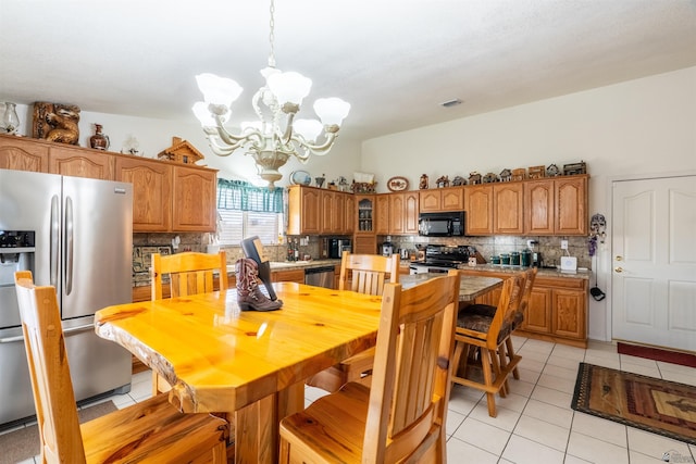 14530 E 55th St, Yuma, AZ 85367 - dining space featuring a notable chandelier, light tile patterned floors, and visible vents