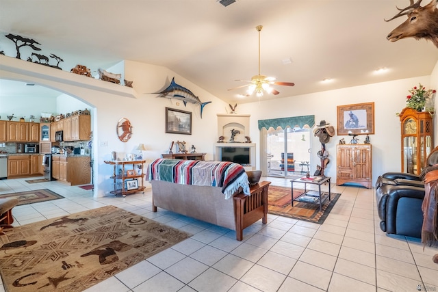 14530 E 55th St, Yuma, AZ 85367 - living room featuring ceiling fan, visible vents, arched walkways, light tile patterned floors, and vaulted ceiling