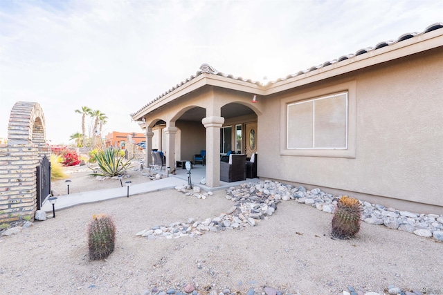 14530 E 55th St, Yuma, AZ 85367 - doorway to property with a patio and stucco siding