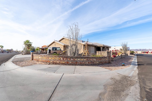 14530 E 55th St, Yuma, AZ 85367 - view of front of house featuring fence, a tile roof, and stucco siding