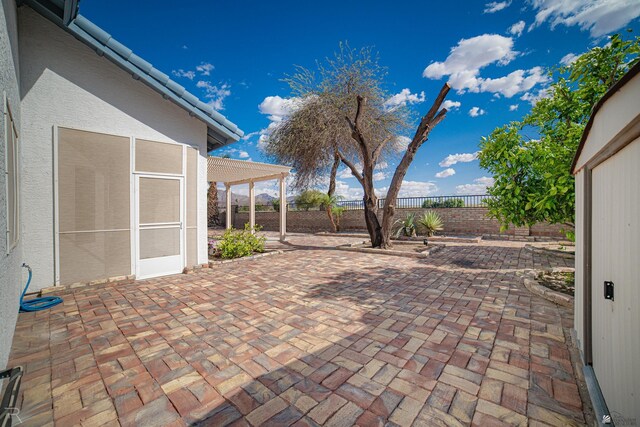 13779 E 54th Dr, Yuma, AZ 85367 - view of patio with a fenced backyard and a pergola